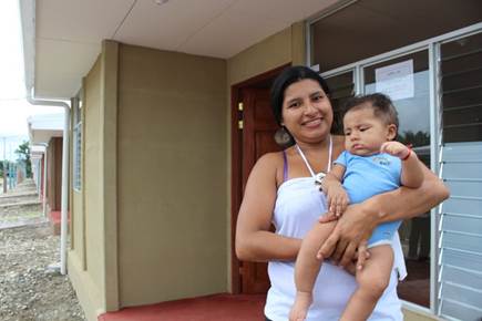 A person holding a baby

Description automatically generated